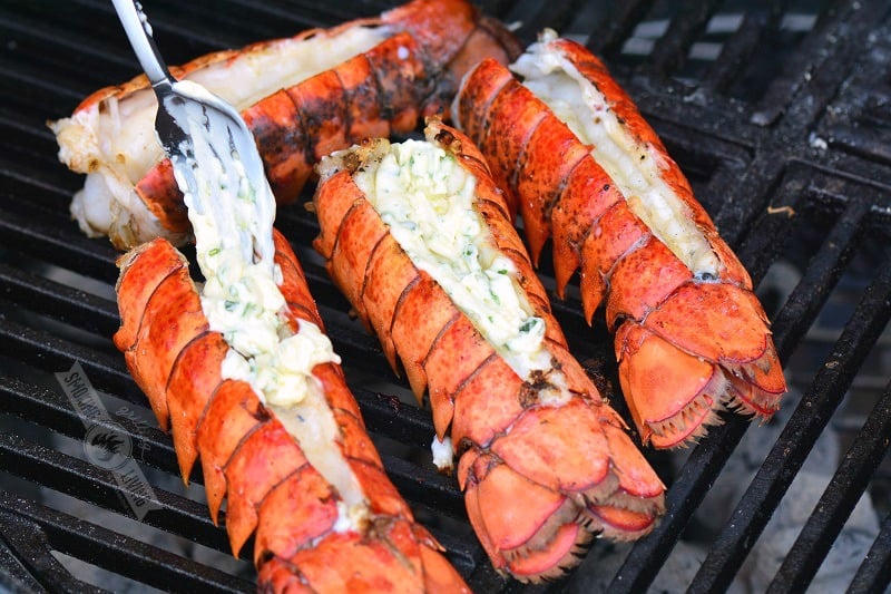 adding finishing butter on lobsters