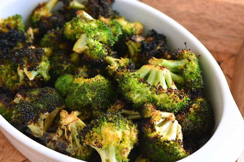 cooked broccoli in a white dish horizontal