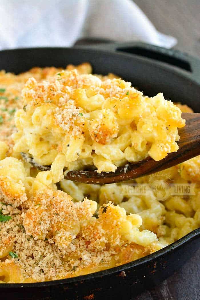 spoonful of mac and cheese coming out of the skillet