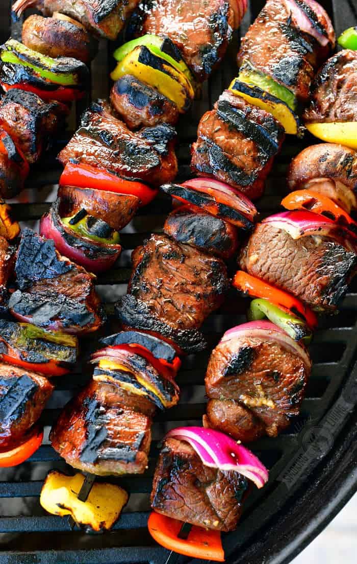 closeup of cooked steak and vegetables on the skewers