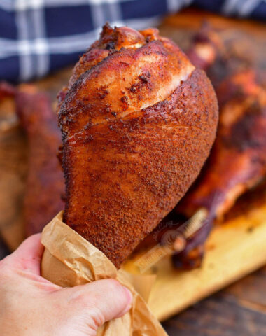 holding a smoked turkey leg