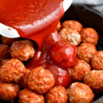 pouring bbq sauce over the meatballs in a skillet