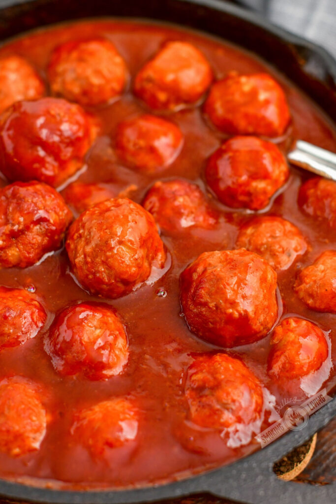 closeup of meatballs in a skillet with bbq sauce