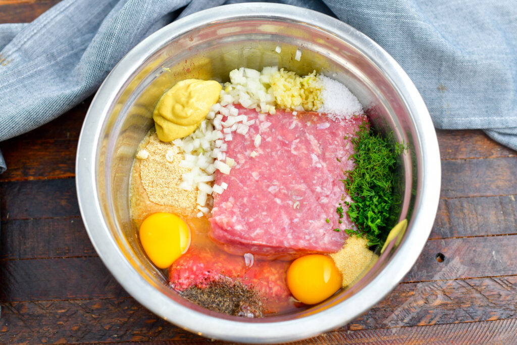 ingredients for meatloaf laid out in a mixing bowl