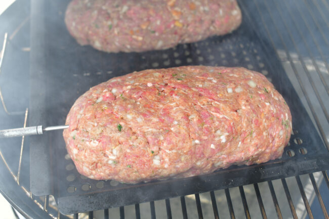 uncooked meatloaf on a smoker