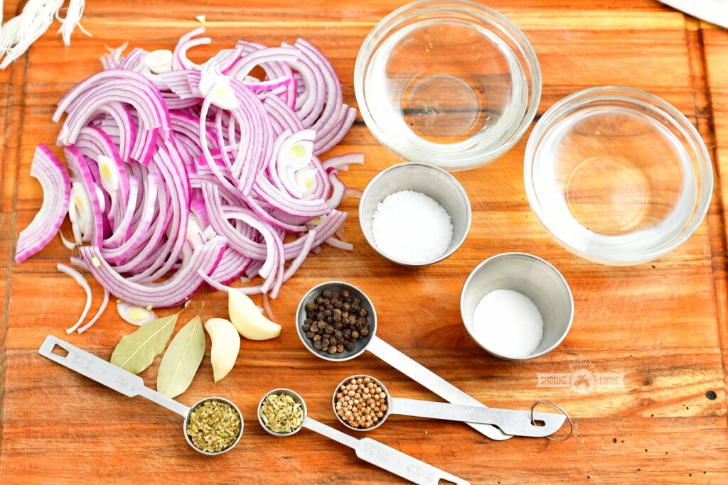 ingredients for pickled red onions on a wooden board