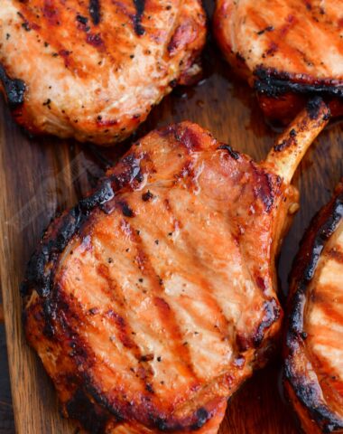 grilled pork chops close up on the cutting board