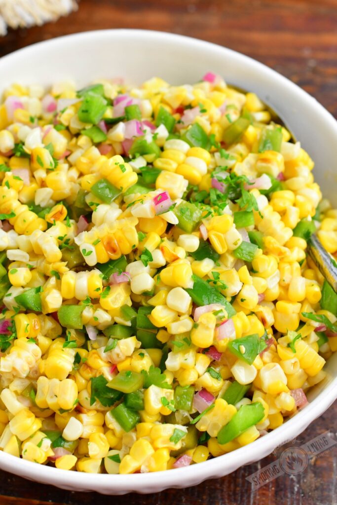 finished grilled corn salad in a white bowl