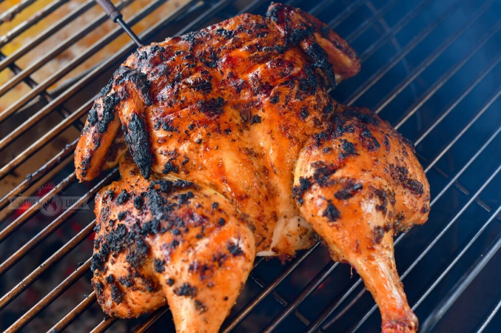 grilled spatchcock chicken on the grill grate