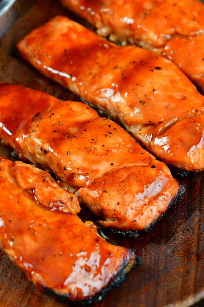 closeup of grilled salmon with maple bbq sauce glazed on top