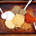 spices for the beef rub on the tray and spoons