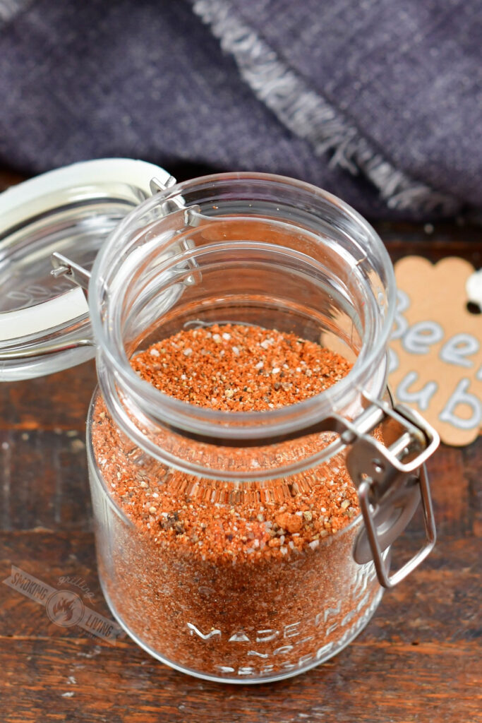 top view of open jar with beef dry rub