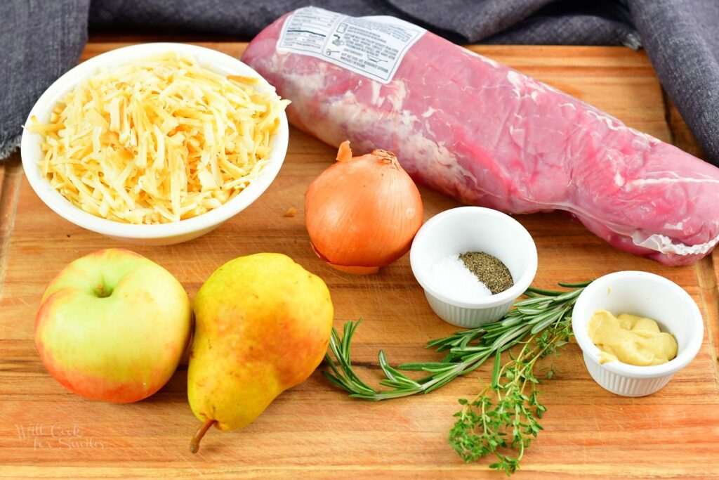 ingredients for stuffed pork tenderloin on a cutting board
