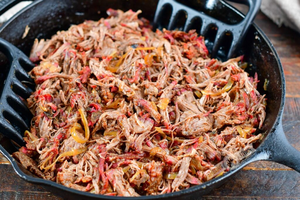 pulled beef chuck in a skillet with claws