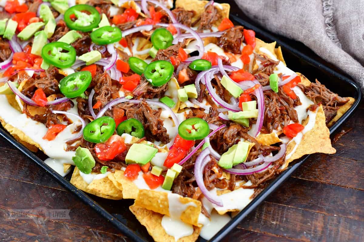 beef nachos topped with veggies