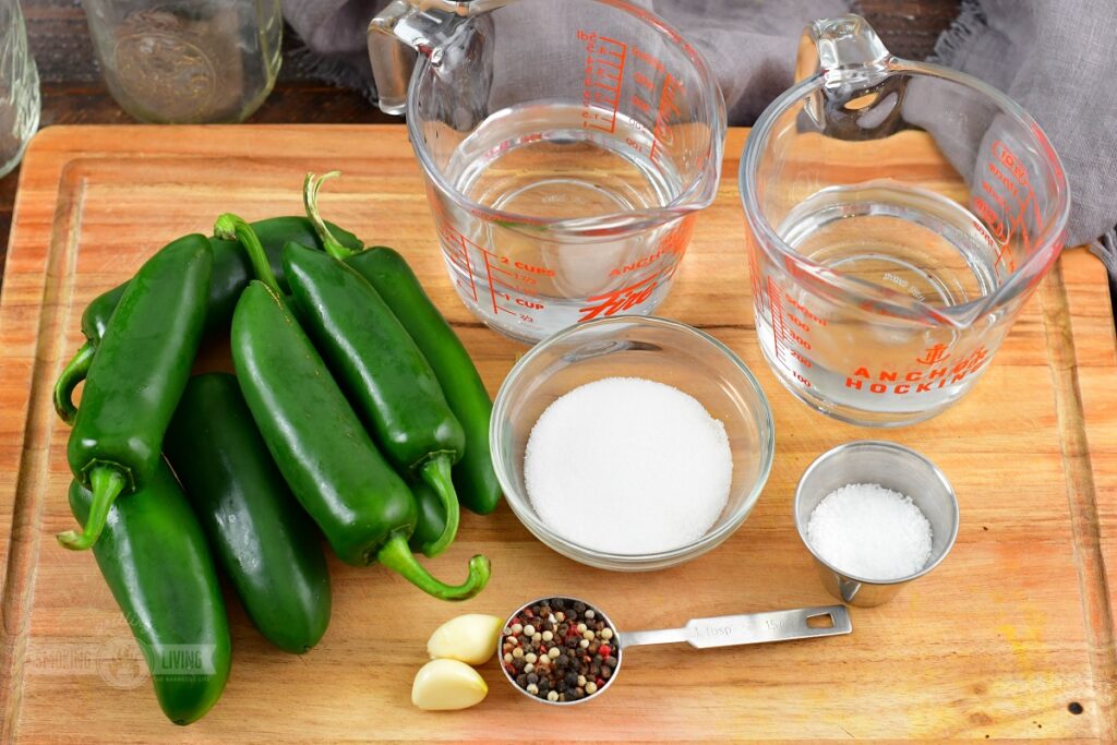 ingredients for pickled jalapenos on cutting board
