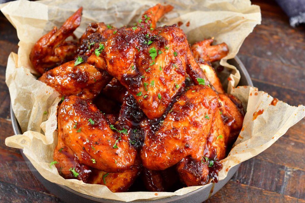 size view of glazed smoked chicken wings in a basket