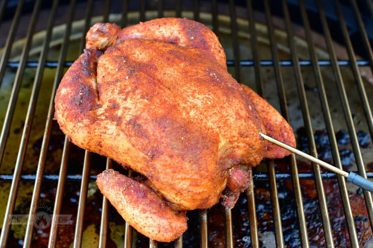 smoked chicken on the smoker with thermometer