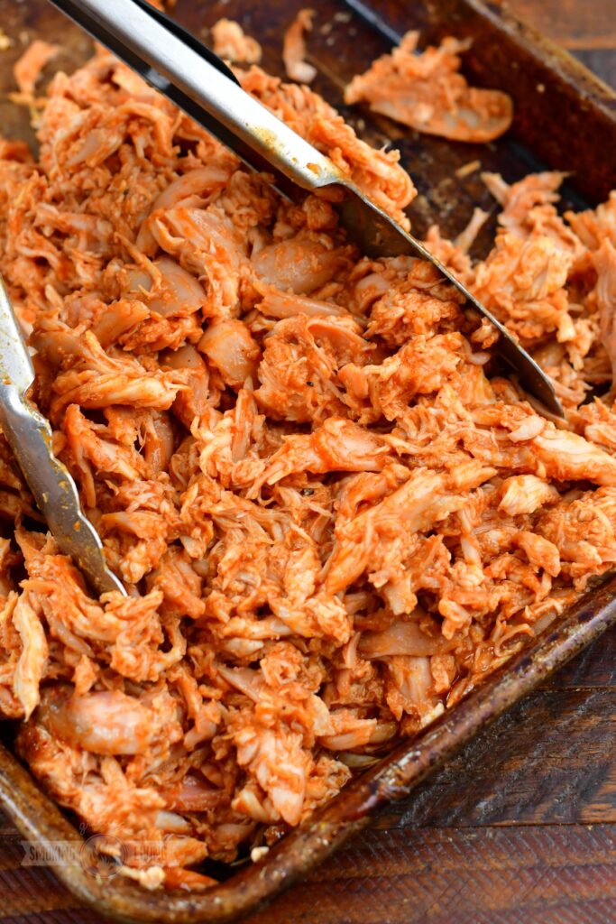 sauced pulled chicken in a pan