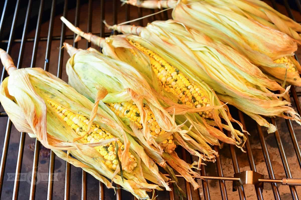 smoked corn on the cob in husks on the smoker