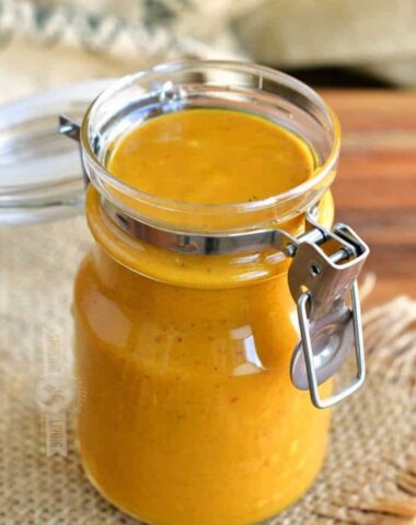 Carolina mustard BBQ sauce in a jar with the lid open.