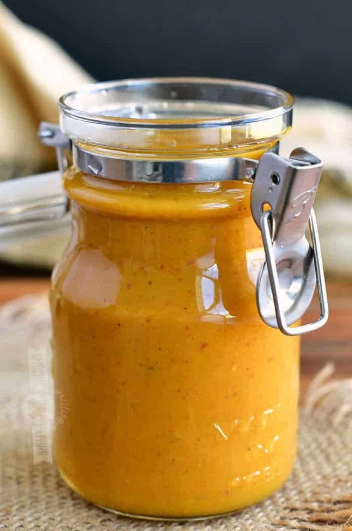 Carolina mustard BBQ sauce in a glass jar.