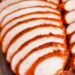 side view of sliced smoked chicken breasts