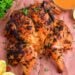 top view of grilled spatchcock chicken on butcher paper
